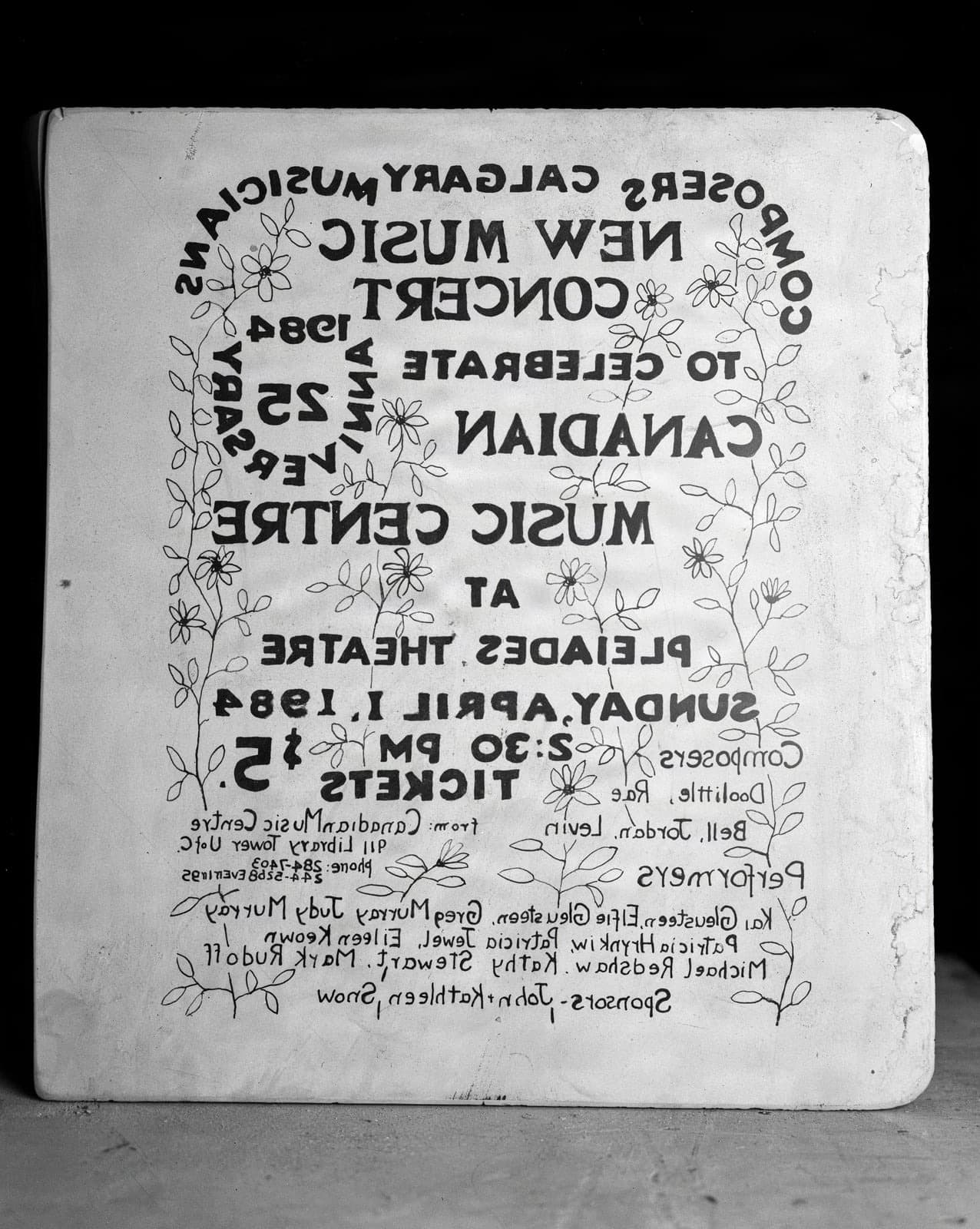 Lithography stone features mirrored text for a 1984 Calgary concert poster.