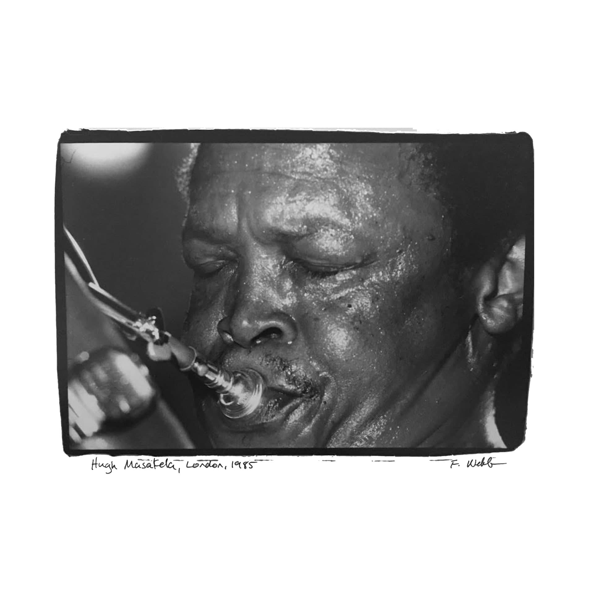 Hugh Masekela performs, eyes closed, playing trumpet in London